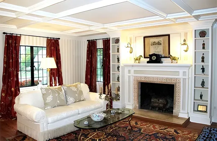 A living room with a fireplace and a couch