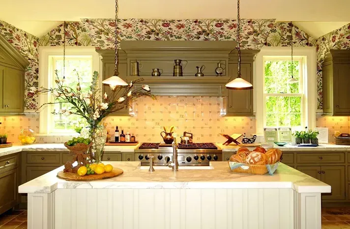 A kitchen with green cabinets and white counter tops
