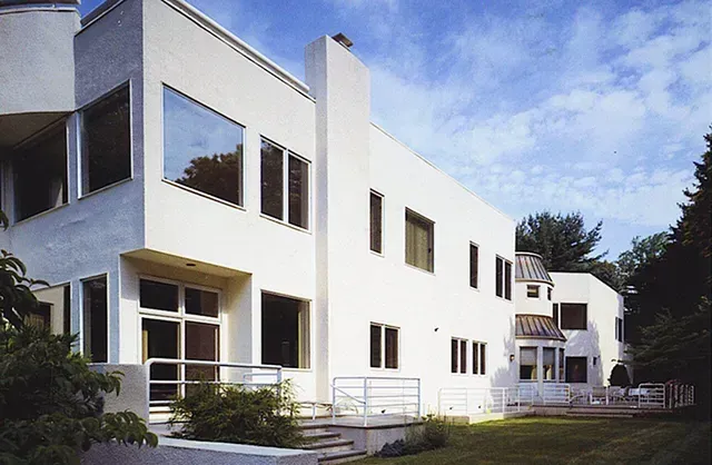 A large white house with a lot of windows