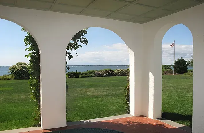 A large house with a lot of windows and shutters