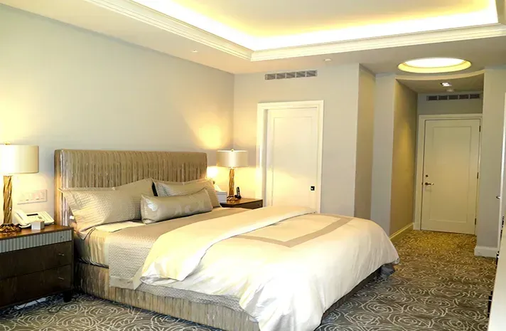 There is a large bed in the middle of the room.