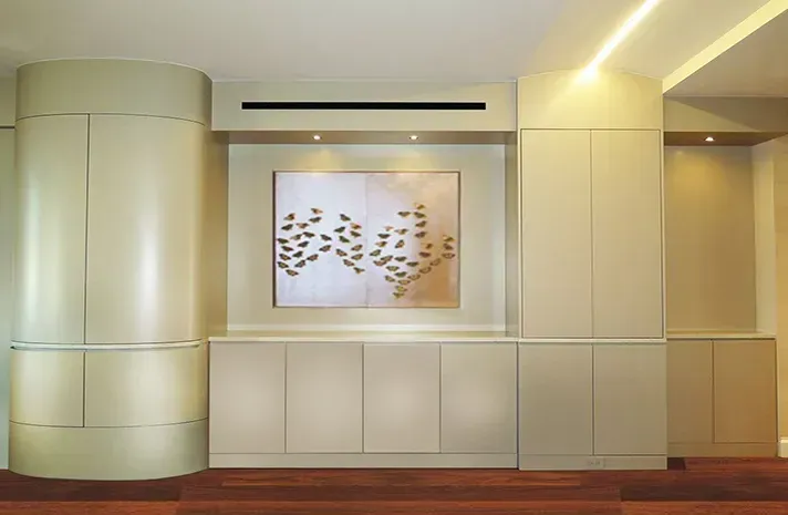 A room with white cabinets and a picture on the wall