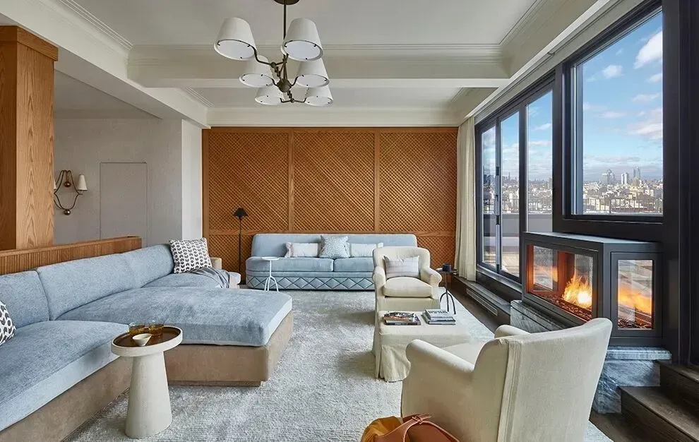 A living room filled with furniture and a fireplace.