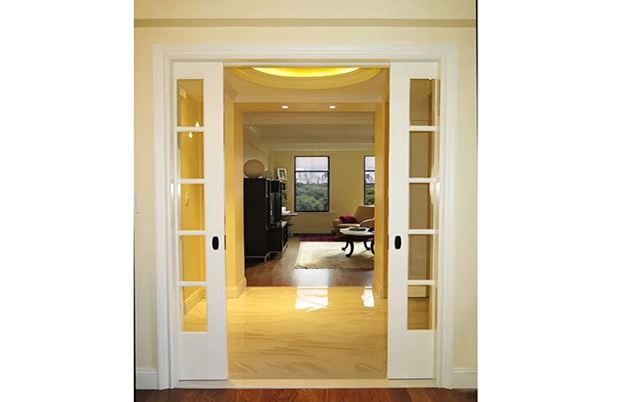 A sliding glass door opens to a living room