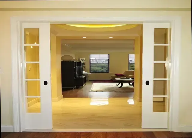 A living room with sliding glass doors leading to it