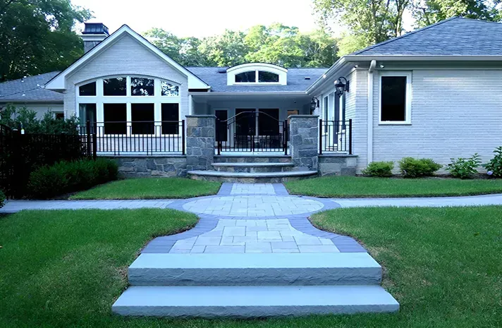 A white house with a walkway leading to it