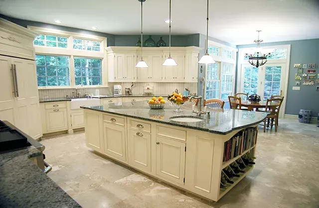 There is a large island in the middle of the kitchen.