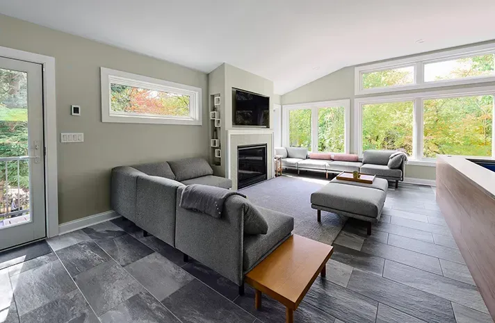 A living room filled with furniture and a fireplace.