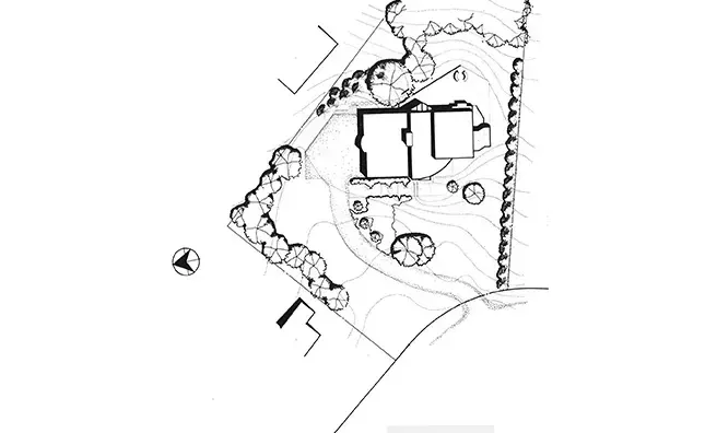 A black and white drawing of a house on a hill.