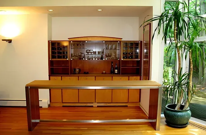 A room with a table and a potted plant
