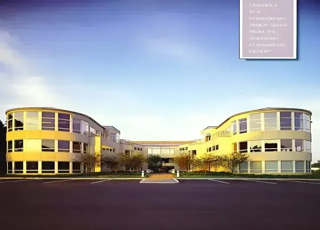 A large building with a blue sky in the background