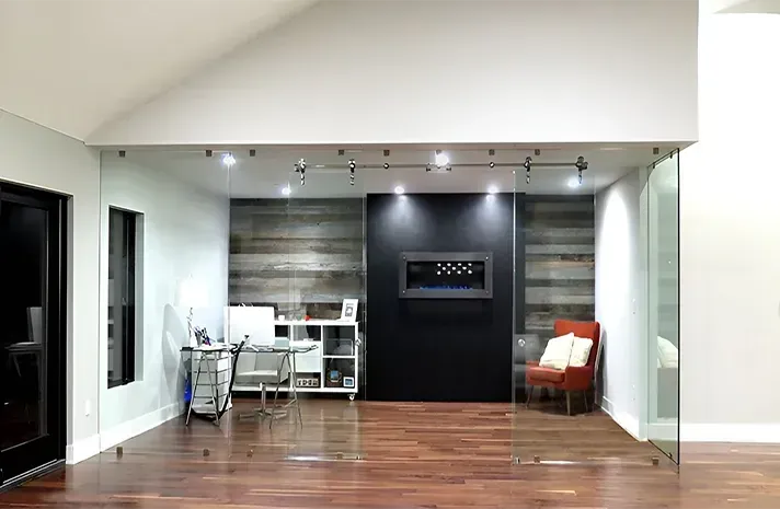 A living room with a fireplace and sliding glass doors.