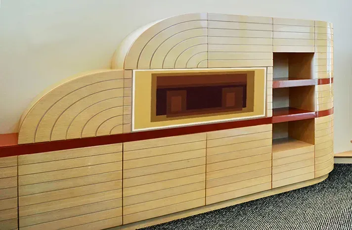 A wooden cabinet with a tv on top of it