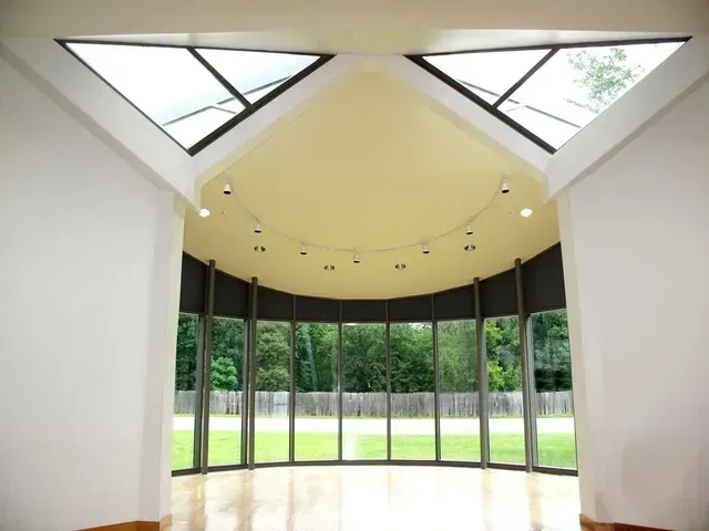 A room with a lot of windows and a skylight
