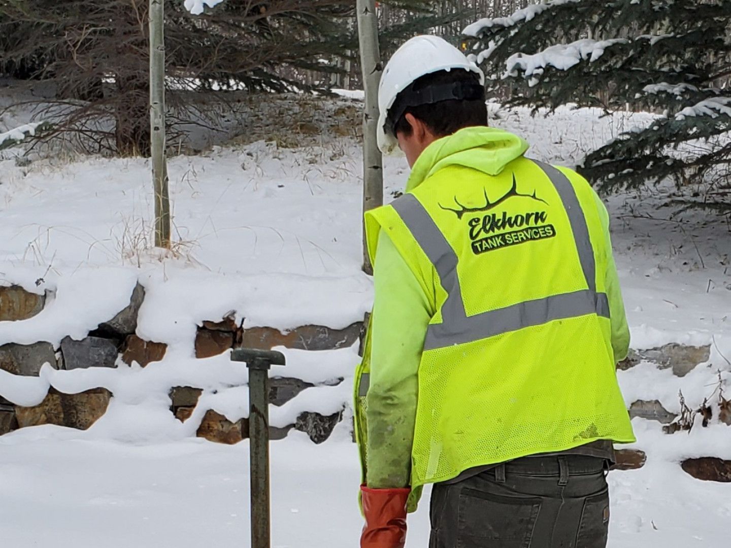 A man wearing a yellow vest that says Elkhorn on it