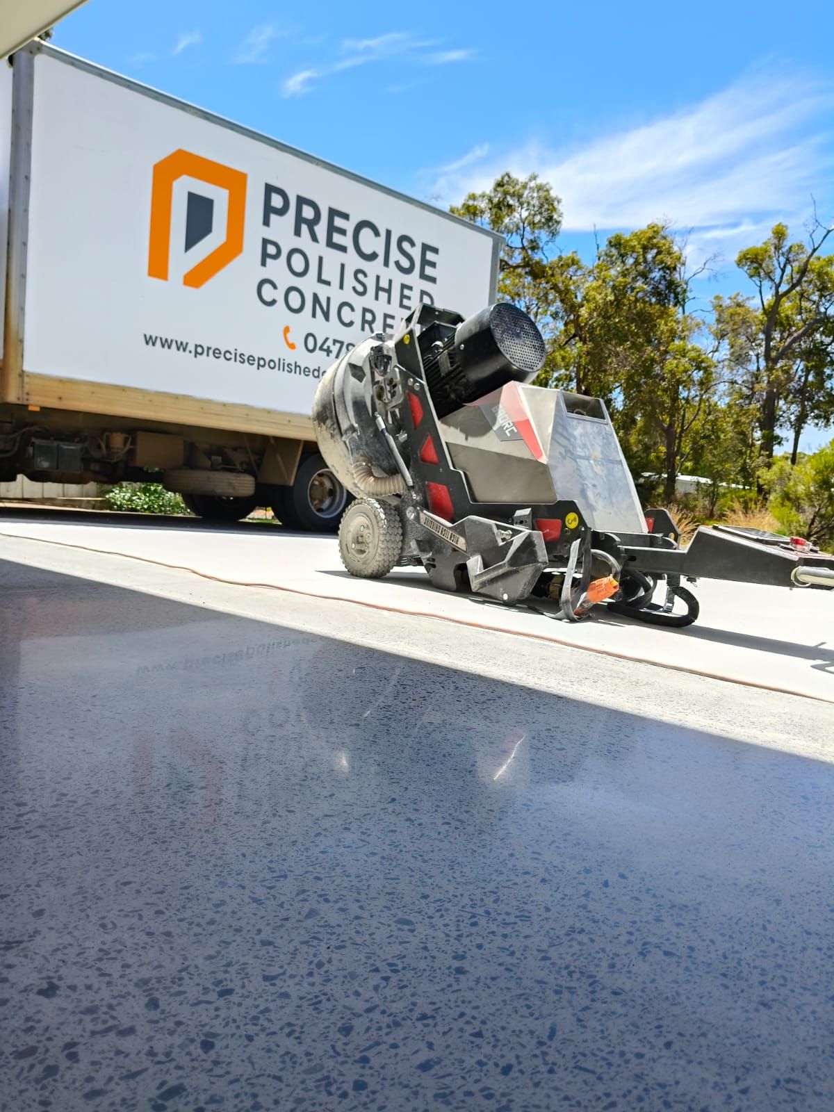 Fully Exposed Concrete polishing machine working.