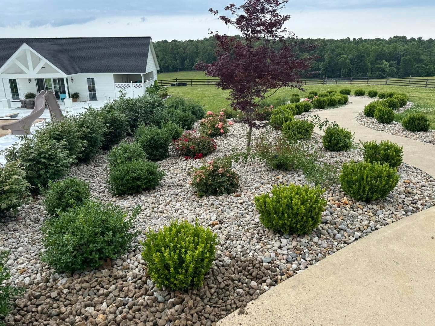 stone flowerbed with shrubs
