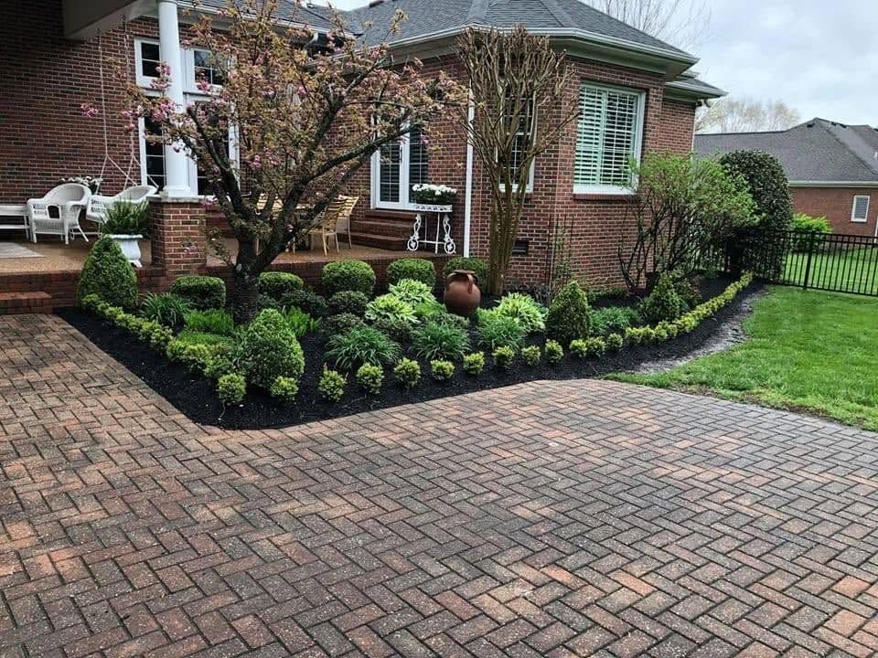 landscaping with brick paver driveway