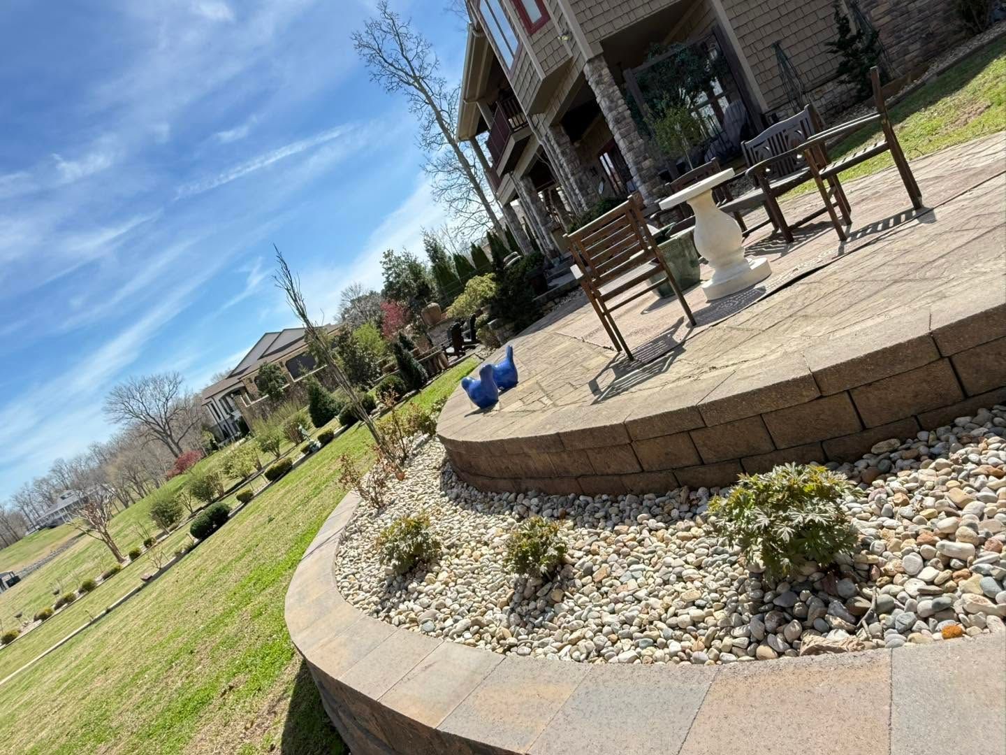 patio surrounded by rock flowerbed