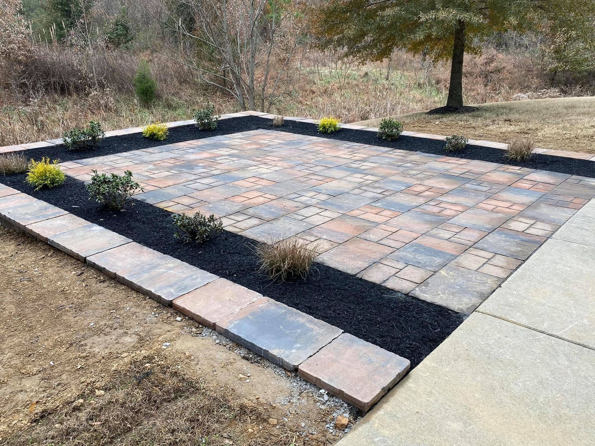 paver patio with flower bed