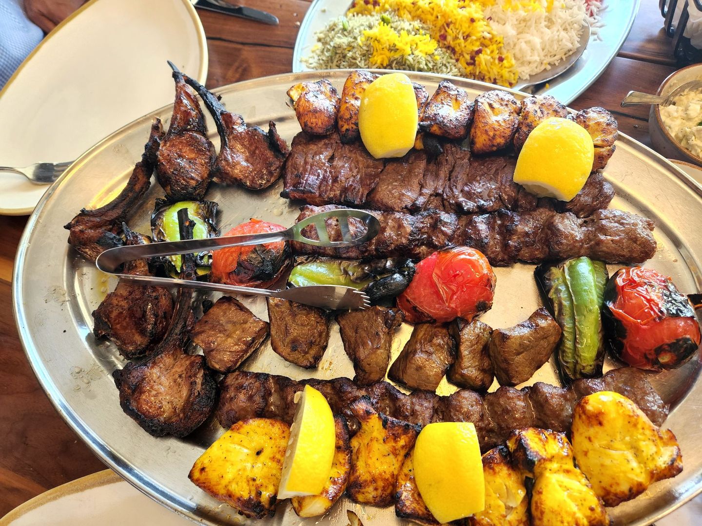 a platter of expertly grilled meats and vegetables
