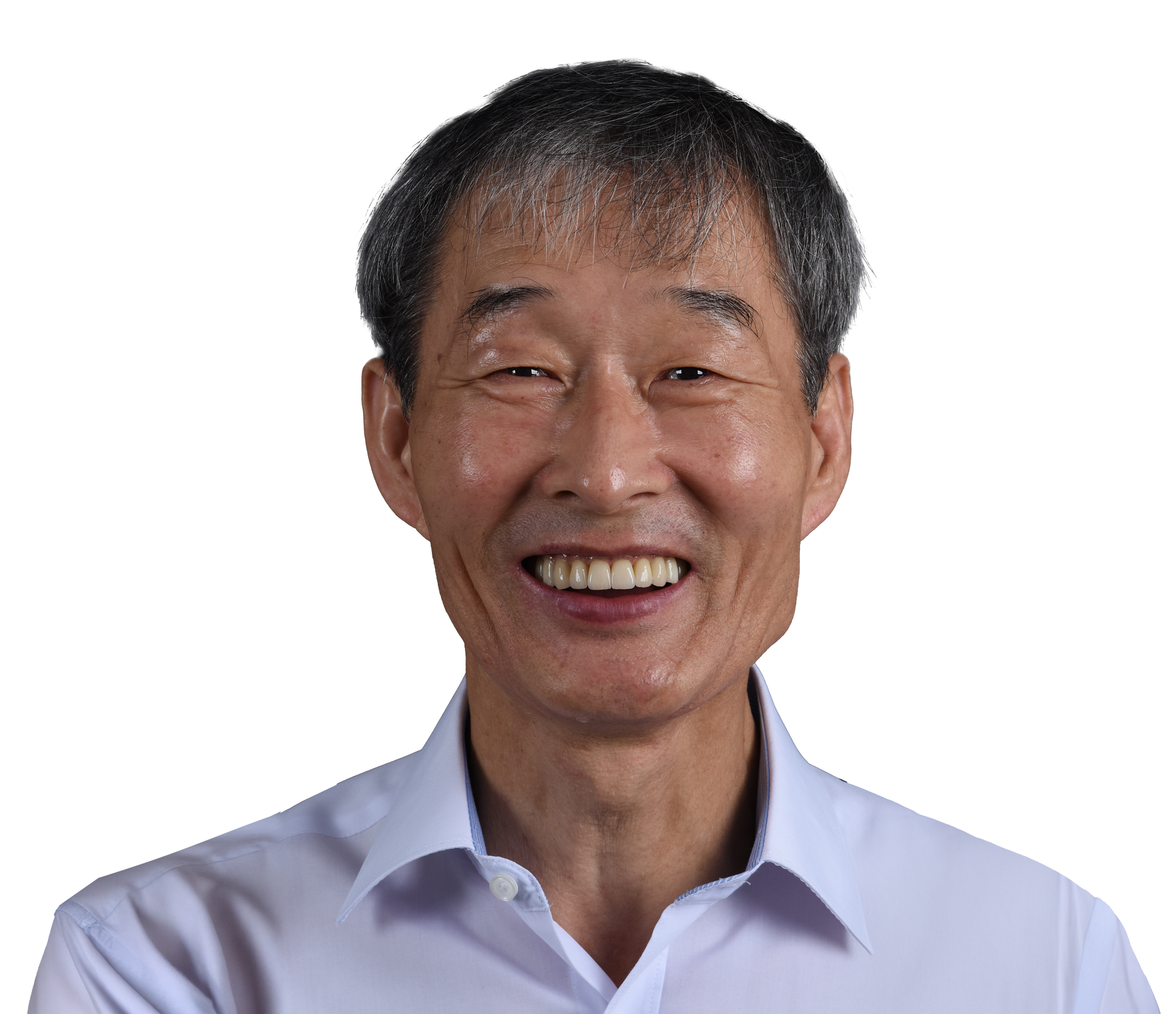 Smiling Asian man in a light blue shirt, head and shoulders portrait.