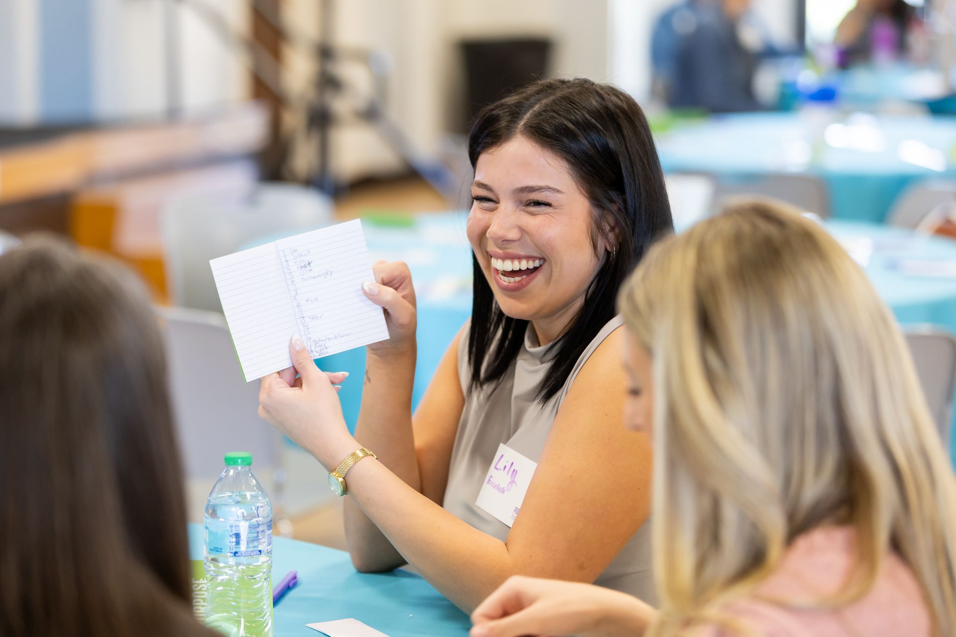 photo of girl showing her notebook