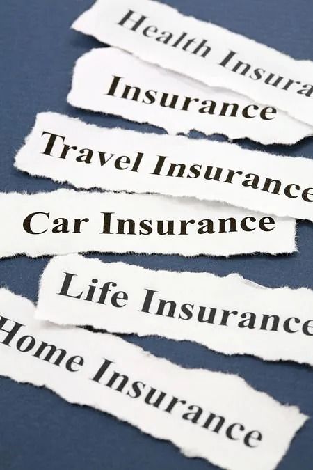 Torn paper labels listing health, insurance, travel, car, life, and home insurance on a blue background