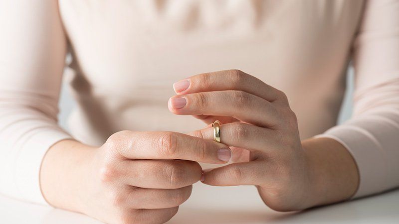 Woman messing with her wedding ring