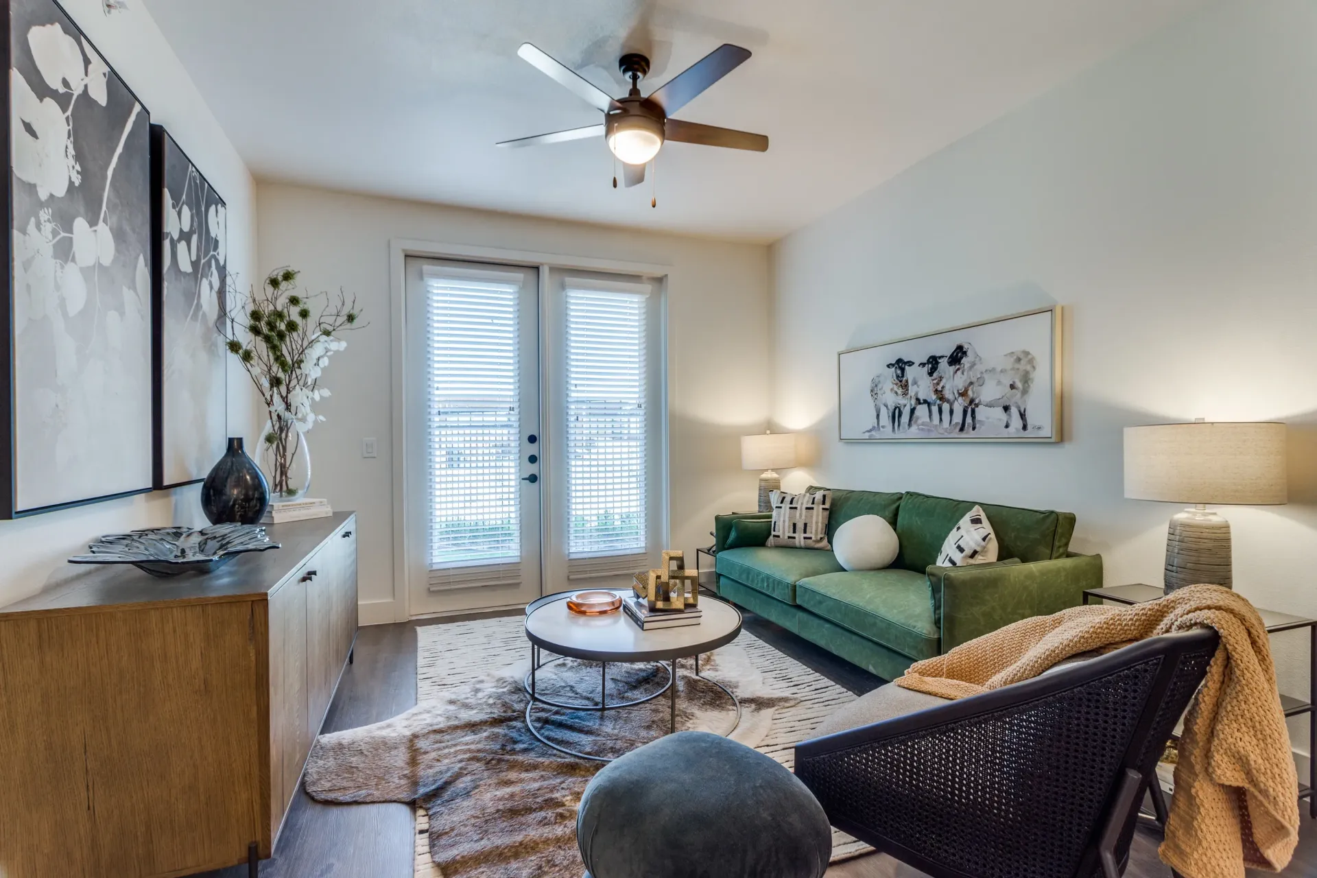 Living room with green sofa, coffee table, and accent chair.