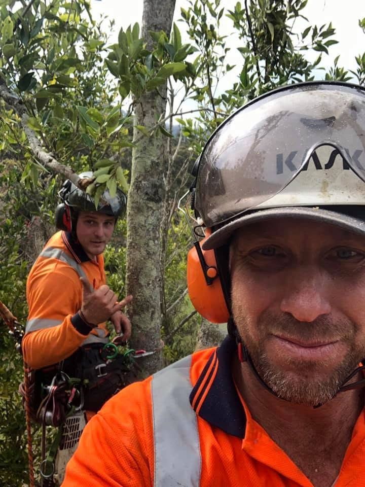 Two Climbers in Orange Gear on a Forested Trail — Burnett Trees in Wollongong, NSW