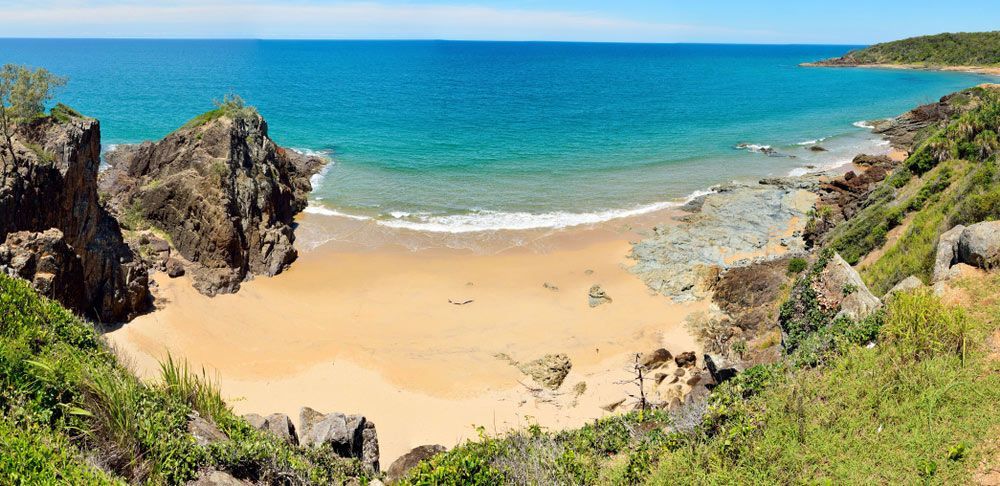 A View of A Beach from A Cliff Overlooking the Ocean — Burnett Trees in Shoalhaven Heads, NSW