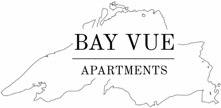 Logo for Bay Vue Apartments featuring the text over a map of Lake Superior.