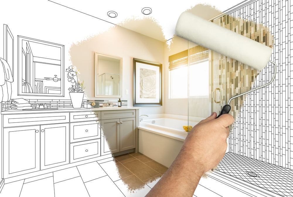 Hand using paint roller, transforming a bathroom sketch into a finished space.