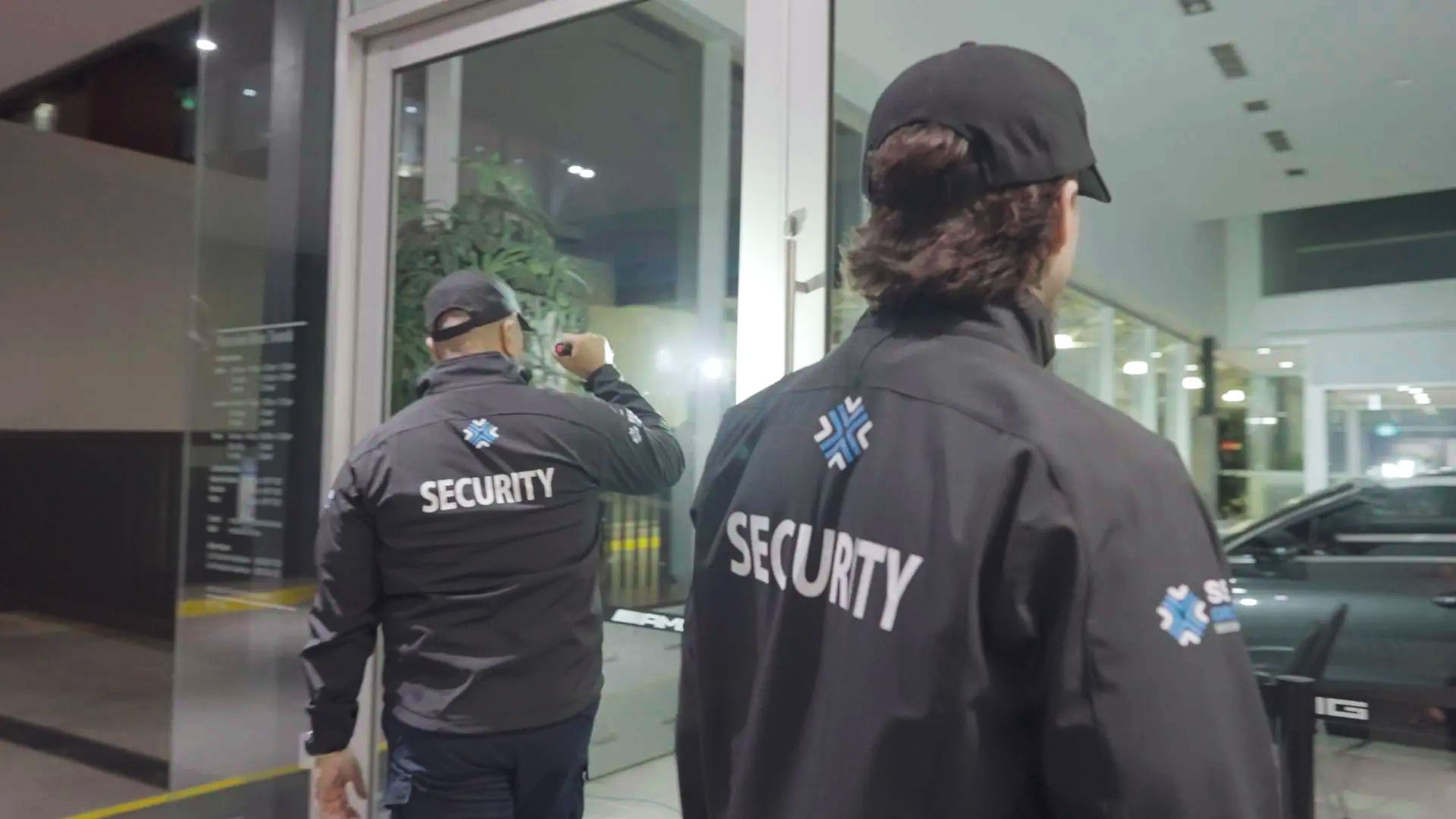 Security guard conducting surveillance and access control in a building