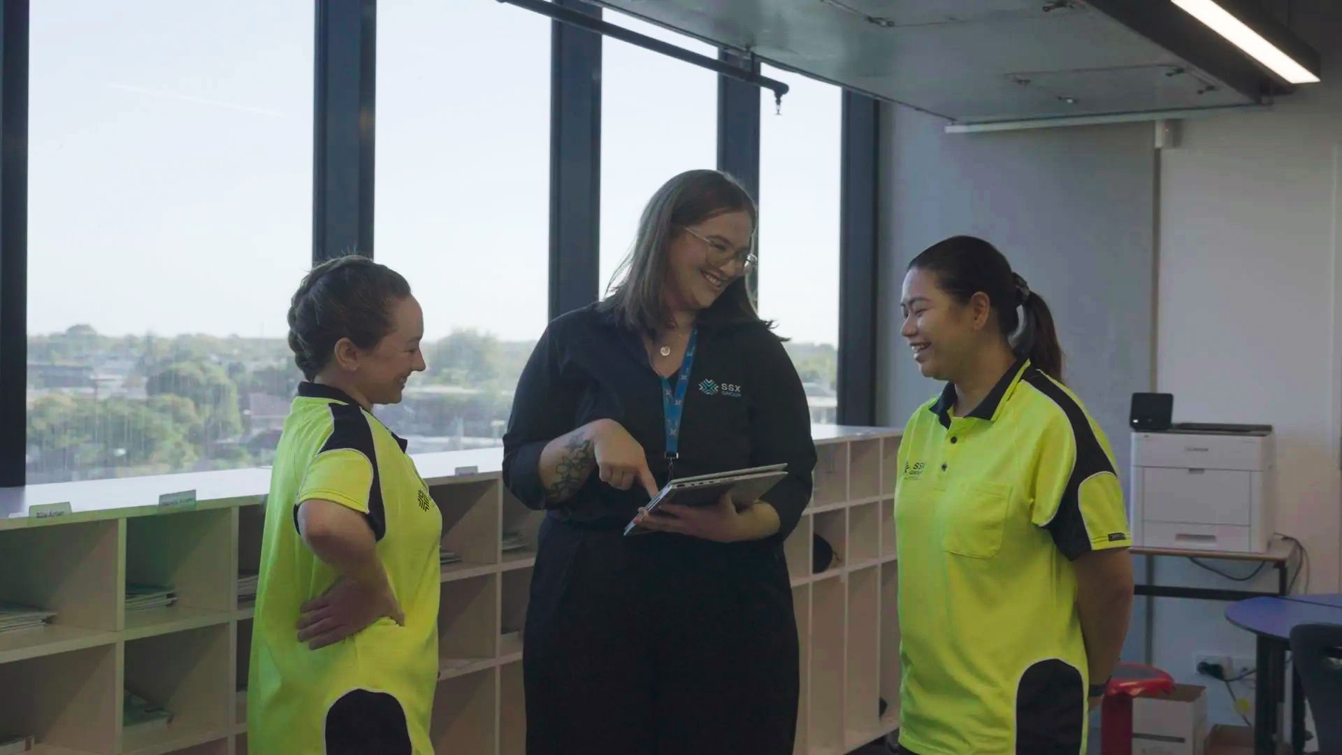 Three women are talking to each other, showcasing interaction and camaraderie within the SSX group.  