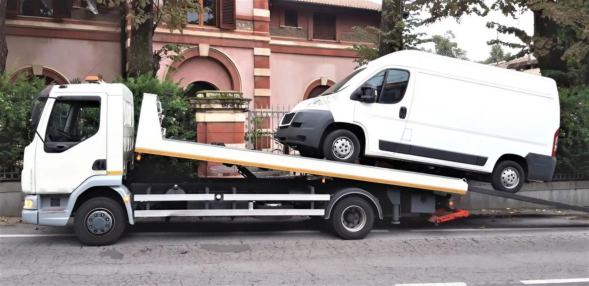 White Tow Truck Carrying a White Van — Alfie's Towing in Bentley Park, QLD