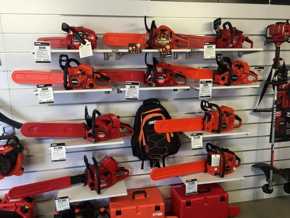 A Display Of Chainsaws On Shelves In A Store — Posties Caravans Boats Small Engines Inverell In Moree, NSW