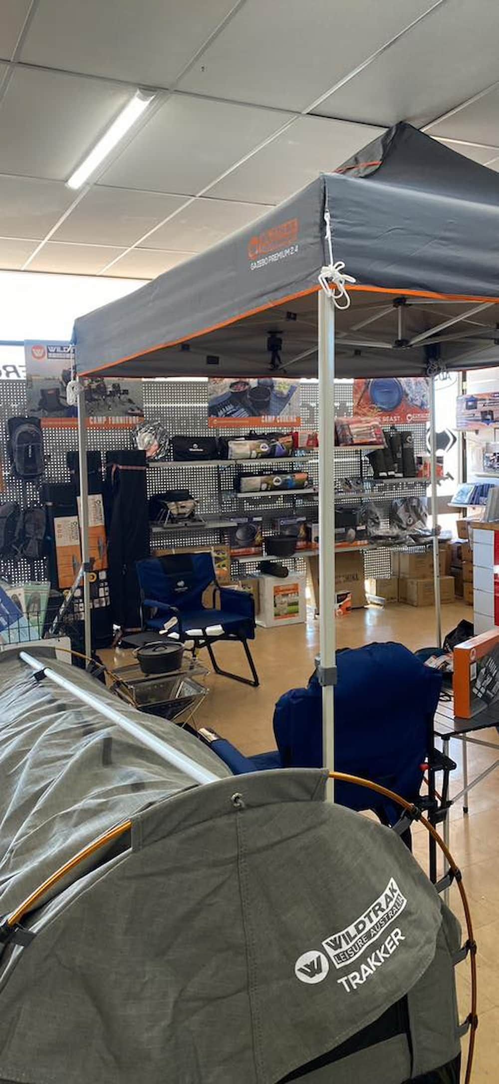 A Tent Is Sitting Under A Canopy In A Store — Posties Caravans Boats Small Engines Inverell In Inverell, NSW