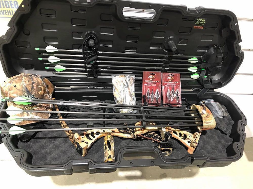 A Bow And Arrows Are In A Case On A Table — Posties Caravans Boats Small Engines Inverell In Moree, NSW