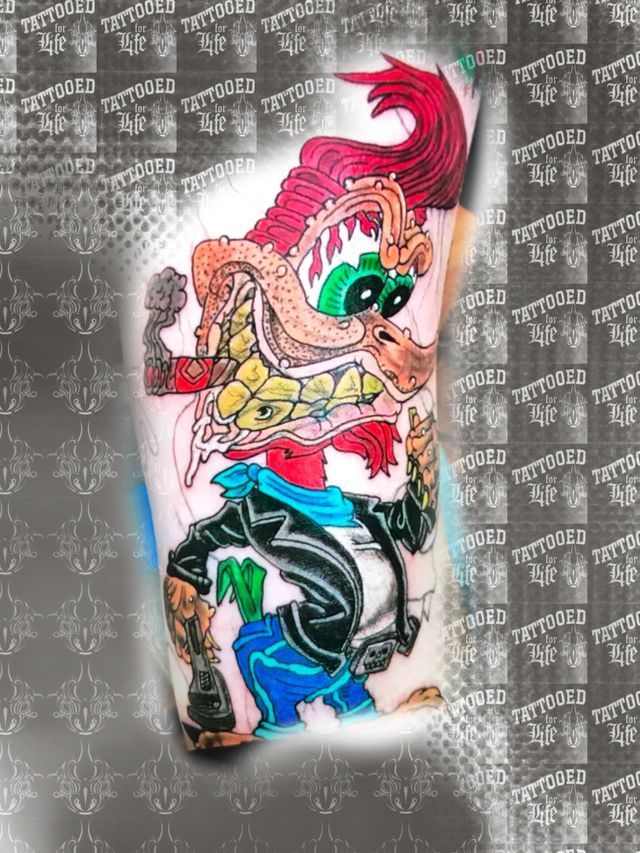 A tattoo of a cartoon character on a person 's arm.