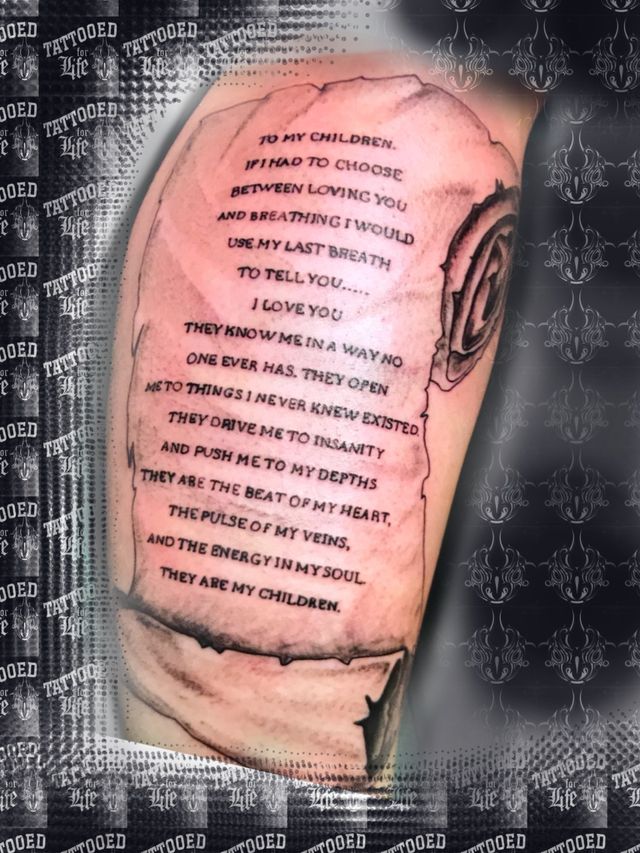 A tattoo on a person 's arm that says i love you