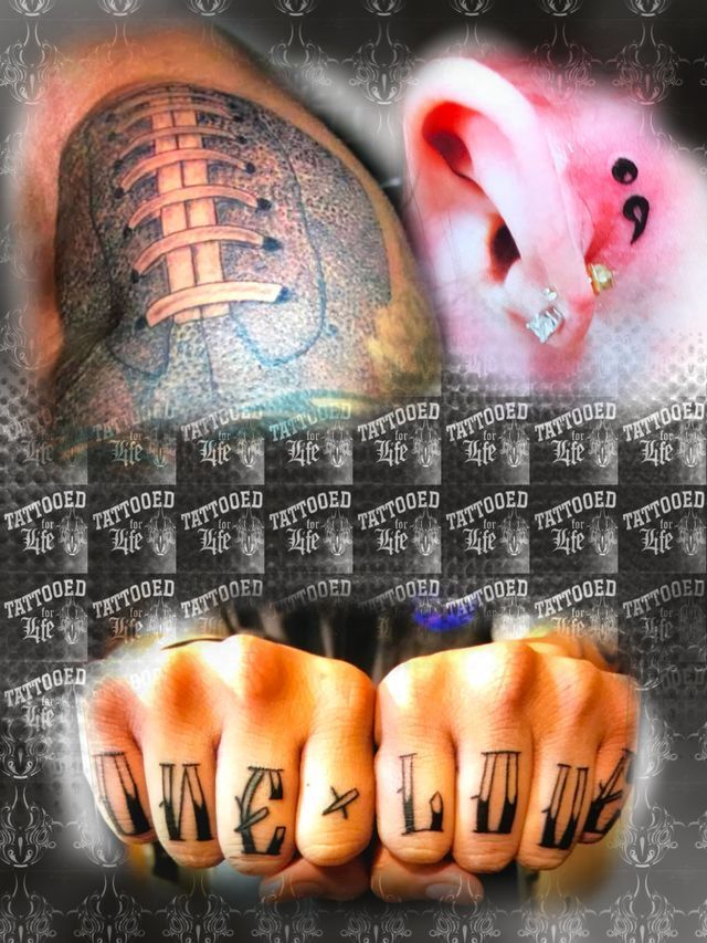 A person with a tattoo on their fist that says one love
