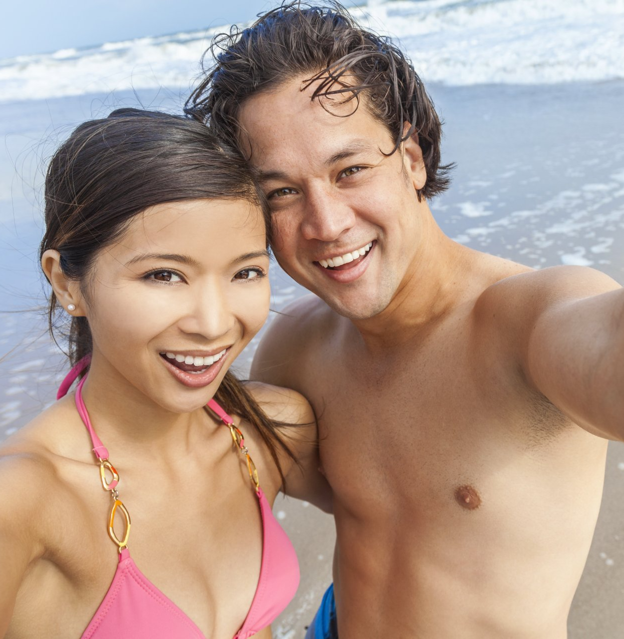 A smiling couple enjoying a day at the beach