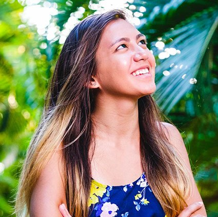 Girl looking up at sky smiling