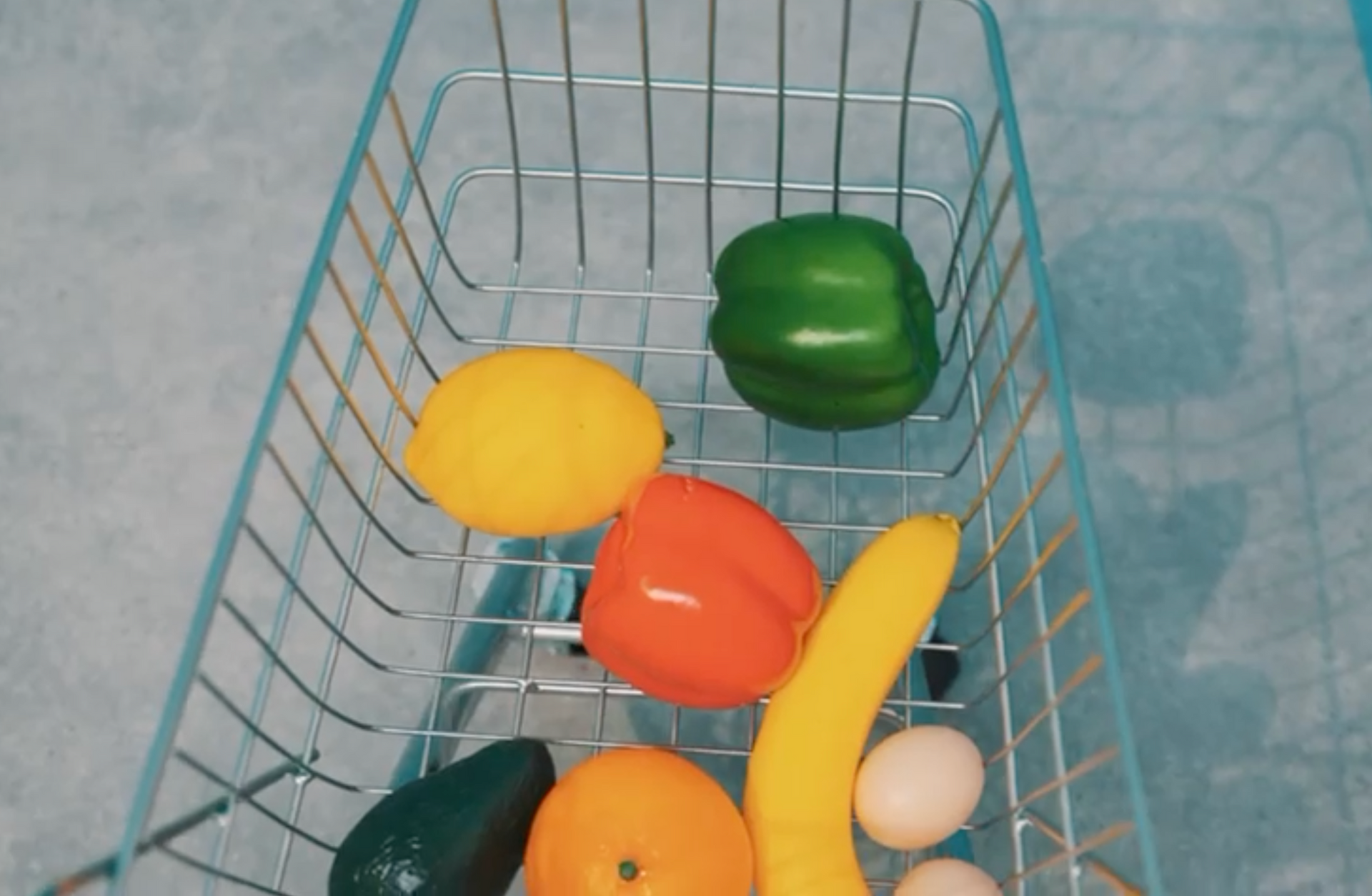 A shopping cart filled with fruits and vegetables