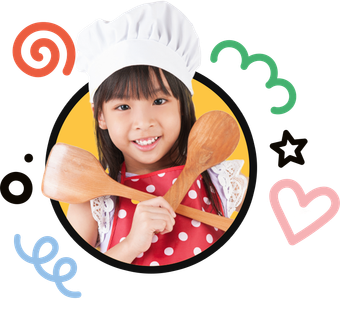 A little girl wearing a chef hat is holding two wooden spoons