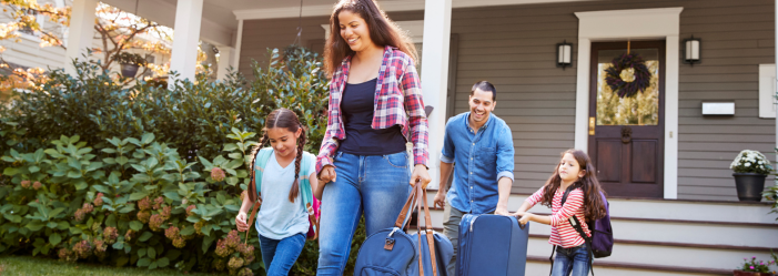 family leaving house for vacation