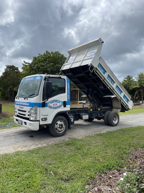 A Truck Loading Materials On Driveway — Zappala Raw Materials Pty Ltd In Mareeba, QLD
