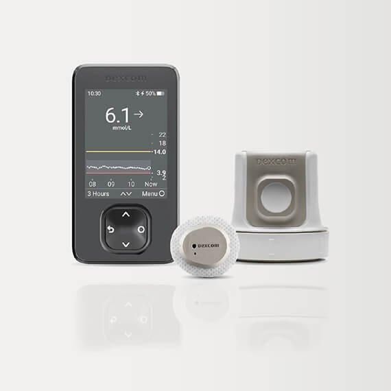 Diabetes glucose meter with display, test strips, and sensor devices on white background